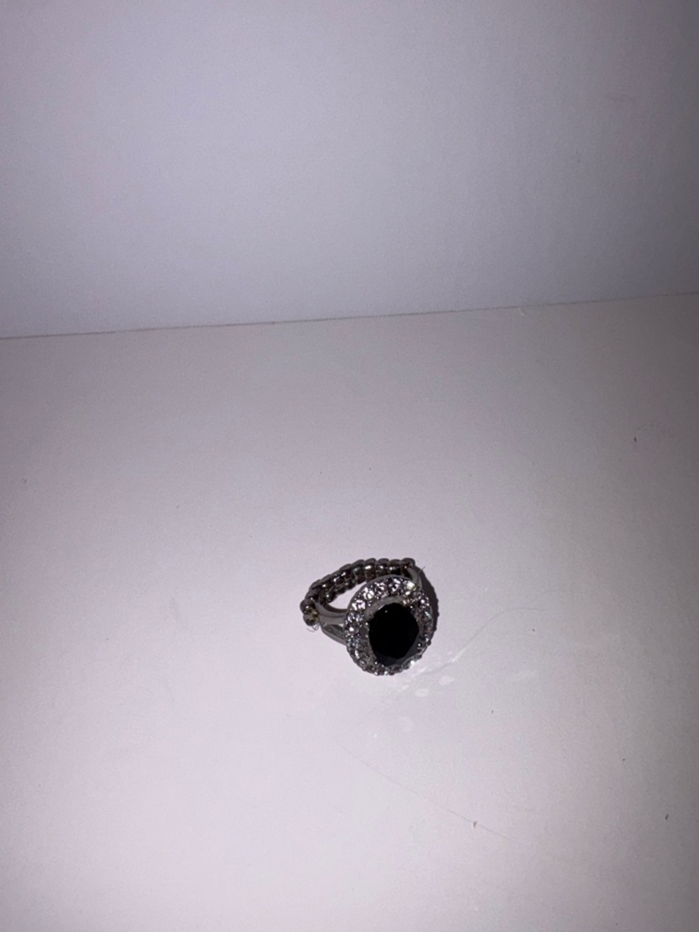 Silver Ring with Black Center Stone and Halo Accent